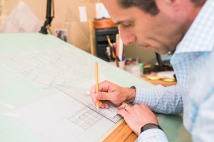Peter Margittai drawing at a drafting table